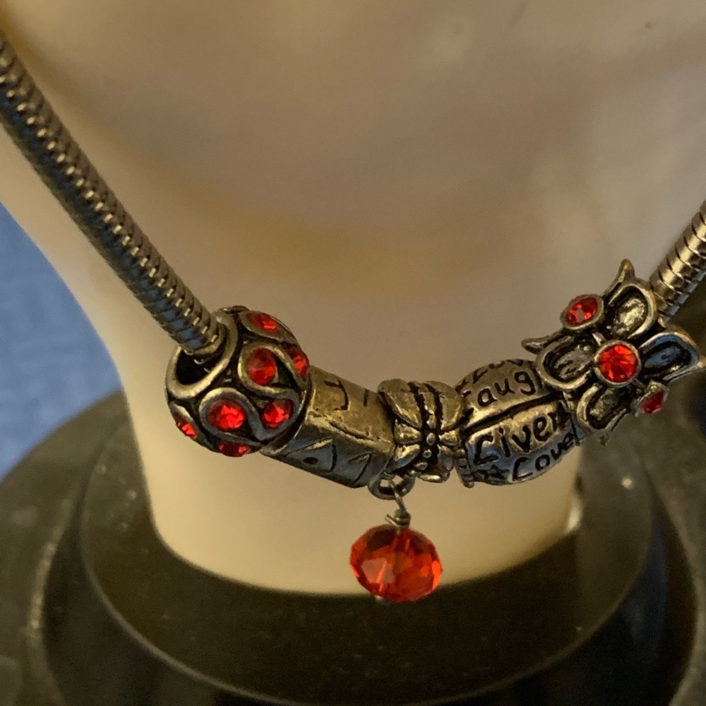 Charm bracelets live love laugh.